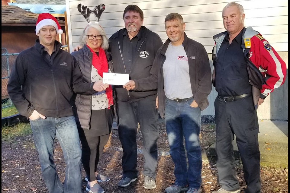 Jayne Ingram with the Lake Cowichan Fire Department. The TimberWest U-Cut firewood program supports the Fire Department’s annual Toy Drive. 2017. (submitted)