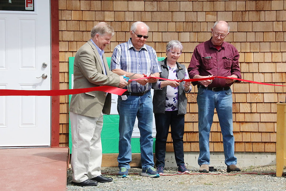 Steve Hunt (USW), Lorne Scheffer (Forest Co-op), Carolyne Austin (Town of Lake Cowichan), and Terry Inglis (Museum volunteers) cut the ribbon to open the new IWA annex at the Kaatza Station Museum on Saturday, May 18. (Lexi Bainas/Gazette)