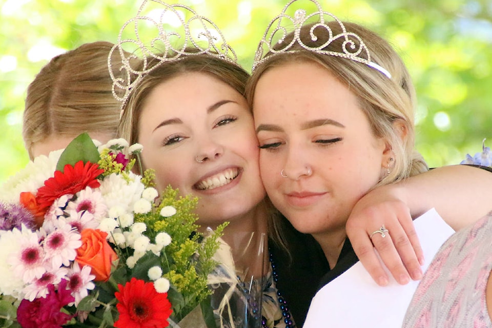 Olivia Skinner and Amber Eddy enjoy a quiet hug backstage after an emotional ‘recognition ceremony’ that thanked them for their hard work during the past year. (Lexi Bainas/Gazette)