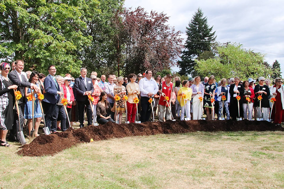 Everyone lines up for an official photo at the sod-turning for Cowichan Hospice House beside Cairnsmore Place on Thursday, July 18. (Lexi Bainas/Citizen)