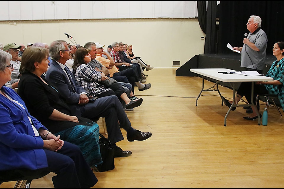 Lake Cowichan Mayor Rod Peters, opens the meeting and explains why everyone is there. (Lexi Bainas/Citizen)