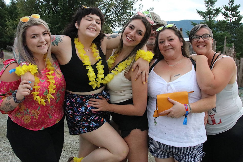 Lake Cowichan’s Sirup family gather for Sunfest’s opening night in a party mood despite threatening skies. (Lexi Bainas/Gazette)