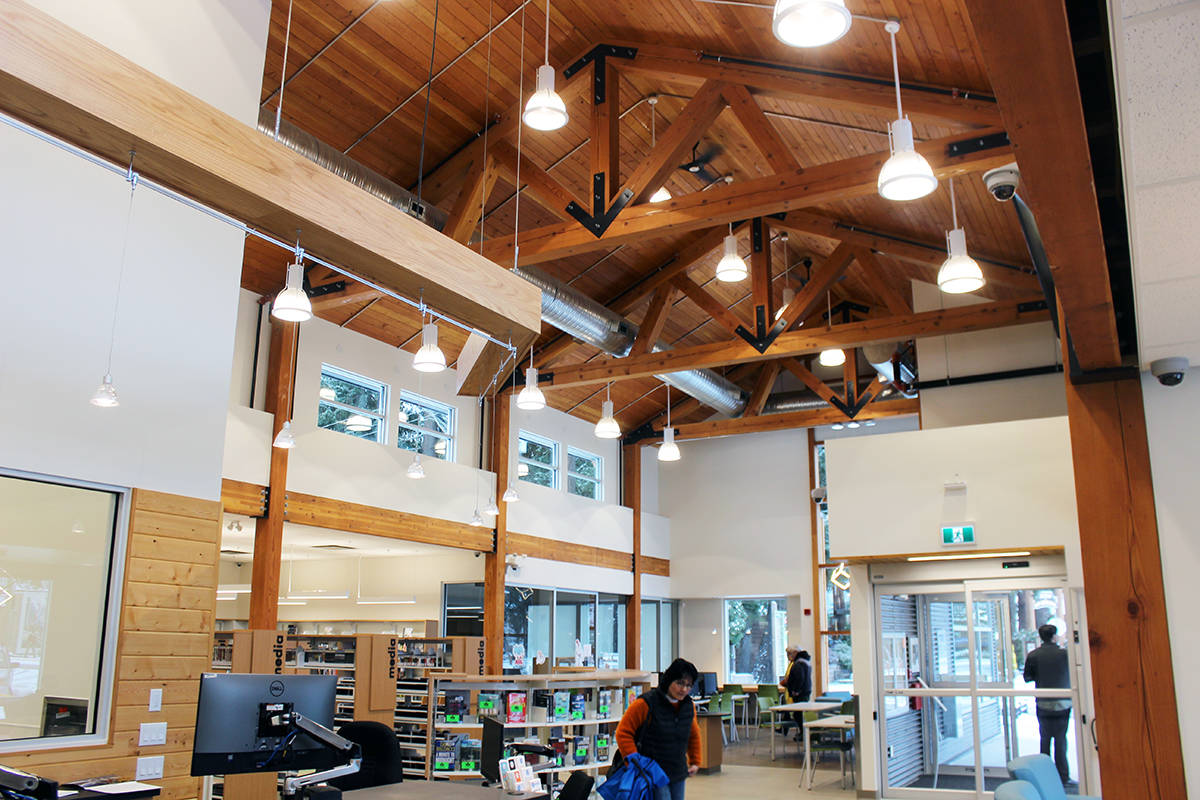 North Cowichan Councillor Debra Toporowski is dwarfed by the spacious inside of the new Chemainus library. (Photo by Don Bodger)