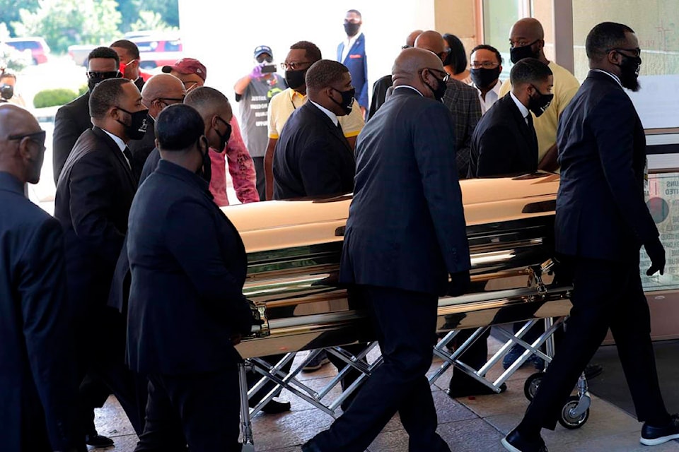 The casket of George Floyd arrives for a public memorial at The Fountain of Praise church in Houston, Monday, June 8, 2020. Floyd died after being restrained by Minneapolis Police officers on May 25. (AP Photo/Eric Gay)