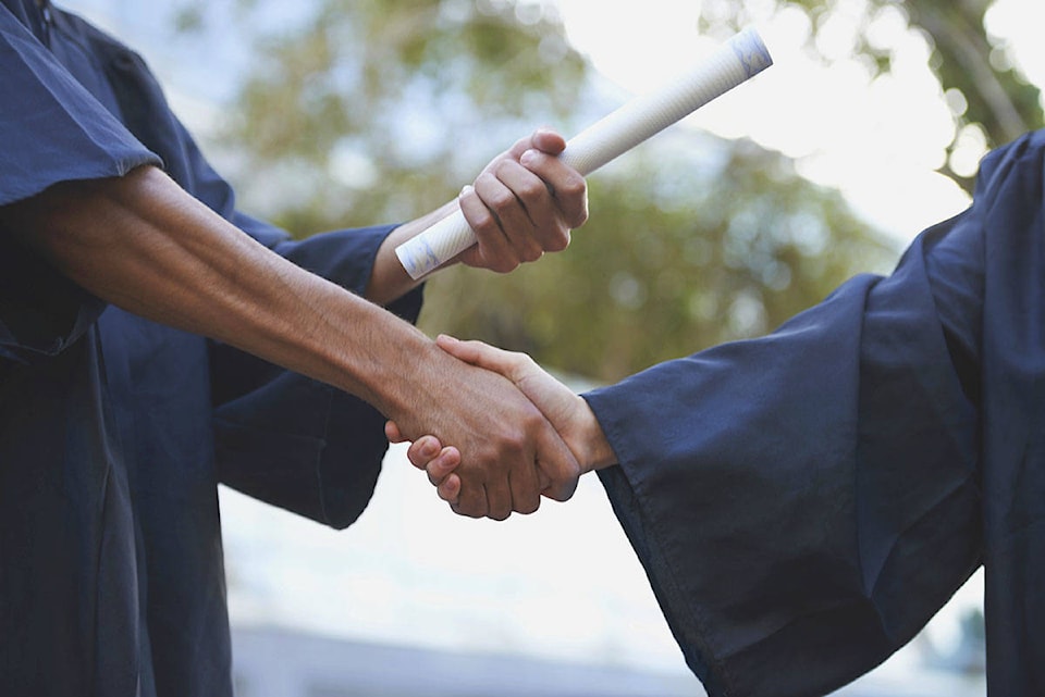 24146490_web1_210211-CCI-Irving-Barber-awards-diploma-handshake-generic_1