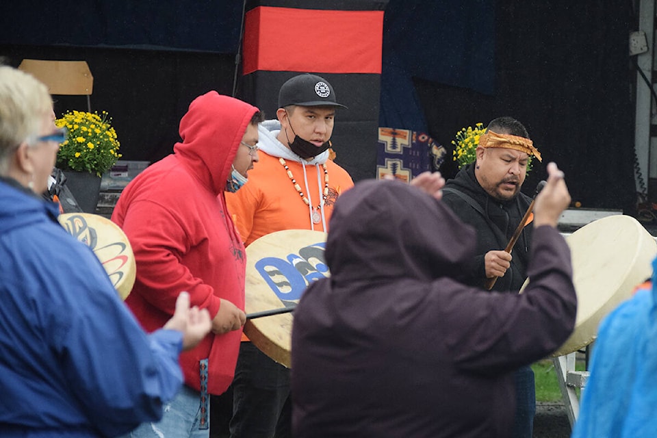 Members of Tseshaht First Nation are joined by School District 70 representatives for a song before the unveiling of Tsuma-as Elementary School’s new name on Sept. 29. (ELENA RARDON / ALBERNI VALLEY NEWS)