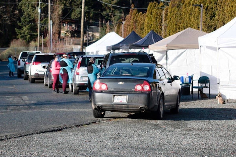 Cowichan Tribes members line up at a drive-up clinic on Jan. 13, 2021, to receive the first doses of the COVID-19 vaccine in the region. (File photo)