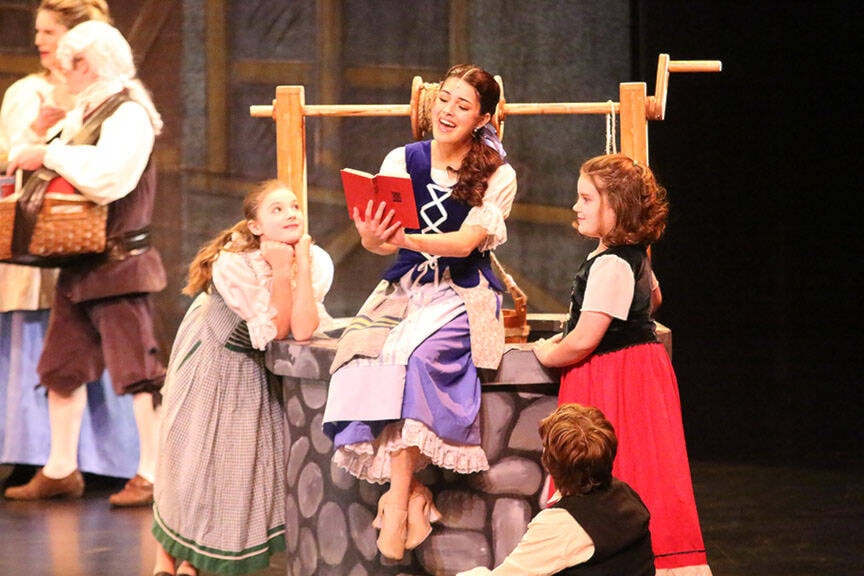 Belle (Alora Killam) sings about her love of books during the opening number of the Cowichan Musical Society’s production of ‘Beauty and the Beast’. For a review and more photos, see page 31, and online at www.cowichanvalleycitizen.com (Kevin Rothbauer/Citizen)