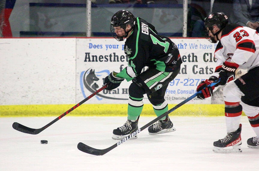 Lake Cowichan Kraken forward Aiden Eddy (14) skates past an Port Alberni Bombers player during the VIJHL team’s final home game of the 2021-22 season last Sunday. (Kevin Rothbauer/Gazette)