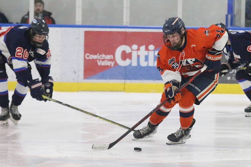 Kerry Park Islanders forward Jackson Egan slips past a Peninsula Panthers defender during last Saturday’s playoff game at Kerry Park Arena. (Kevin Rothbauer/Citizen)