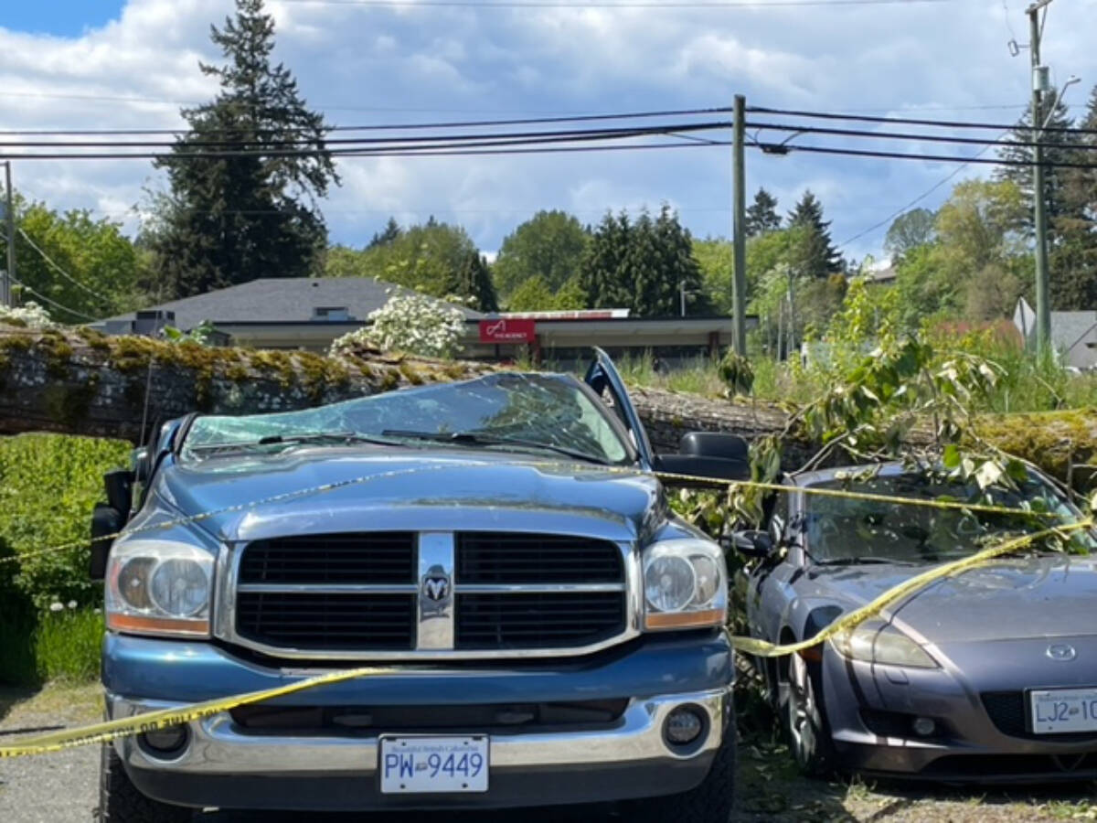 29181390_web1_220526-CCI-wind-storm-damage-crushed-cars_1