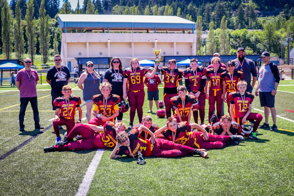 The peewee Cowichan Bulldogs hoist the Dogwood Bowl after an 8-0 win over the Victoria Spartans last Saturday. (Jen Laver photo)