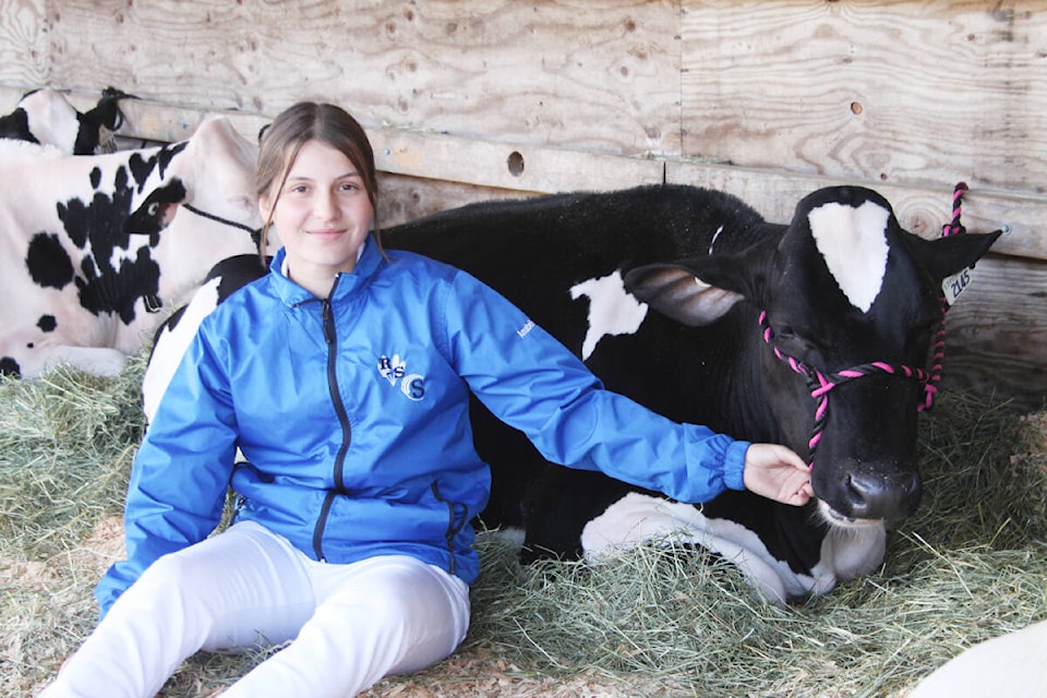 Annabelle Faustino of the 4H Club sits with her project at the Cowichan Exhibition, 2022. (Andrea Rondeau/Citizen)