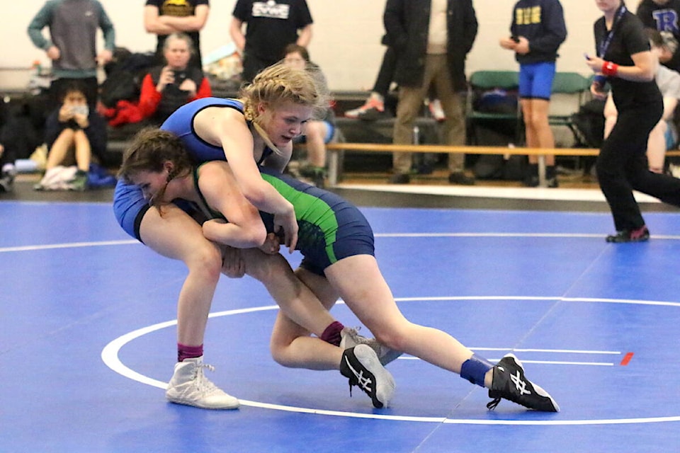 QMS wrestler Ripley Fox wrestles Oak Bay’s Vesna Mackillop on her way to a second place finish overall at the Vancouver Island Wrestling Championships on Saturday Feb. 11. (Sarah Simpson/Citizen)