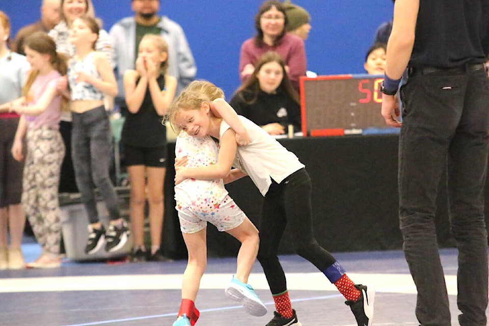 Ecolé Cobble Hill’s Noëlle Maguire-Horn (right) and Charlotte Cooper, both in Grade 3 wrestle during the elementary wrestling playdown tournament on Feb. 16 at Queen Margaret’s School. (Sarah Simpson/Citizen)