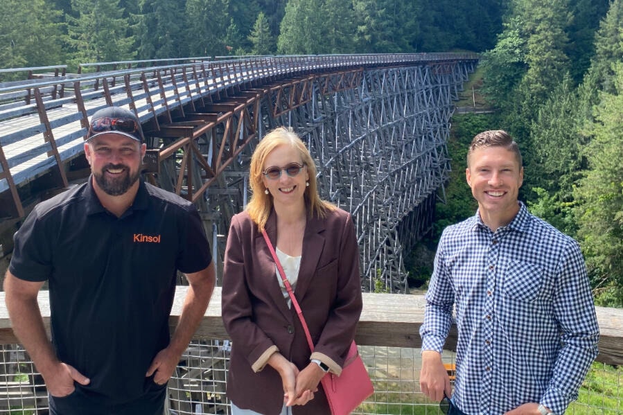Tyler Hiltunen and Steve Stevenson from Kinsol Timber Systems pose with Brenda Bailey, Minister of Jobs, Economic Development and Innovation, at the Kinsol Trestle. (Submitted photo)
