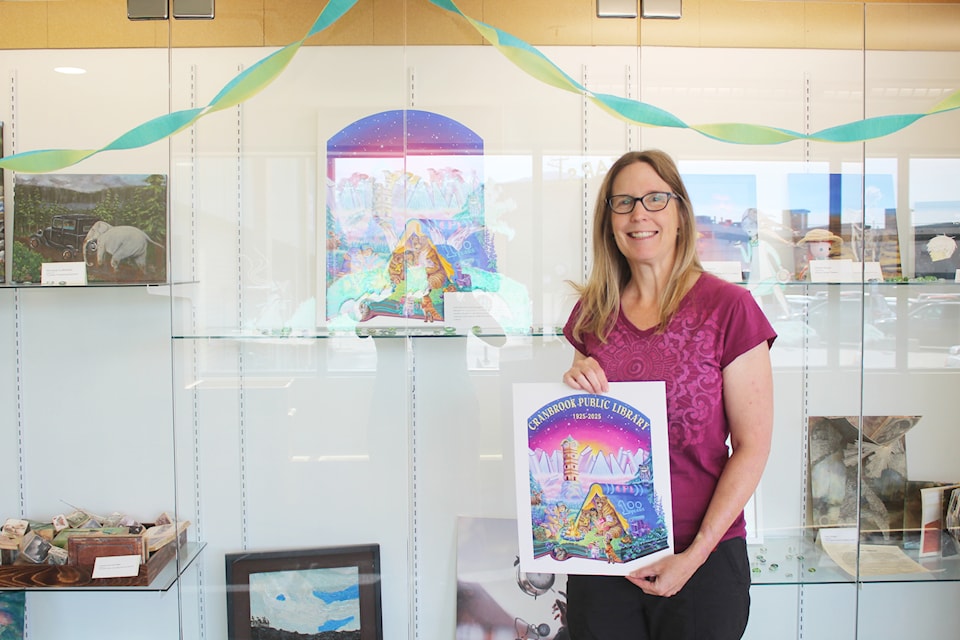 Artist Kirsten Taylor stands with her acrylic painting that she created for the Cranbrook Public Library's 100th anniversary on July 4, 2025 (Gillian Francis/CranbrookTownsman)