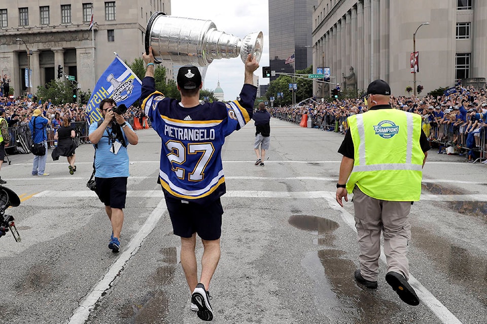 St. Louis Blues defenseman and captain Alex Pietrangelo carries the Stanley Cup during the Blues’ NHL hockey Stanley Cup victory celebration in St. Louis on Saturday, June 15, 2019. (AP Photo/Darron Cummings)