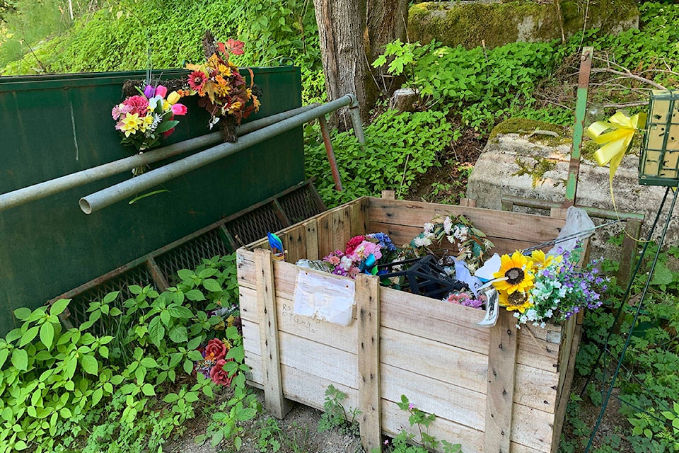 Flowers and other adornments left at Hope Cemetery have been moved off to a back storage and maintenance area. (Jessica Peters/ Hope Standard)