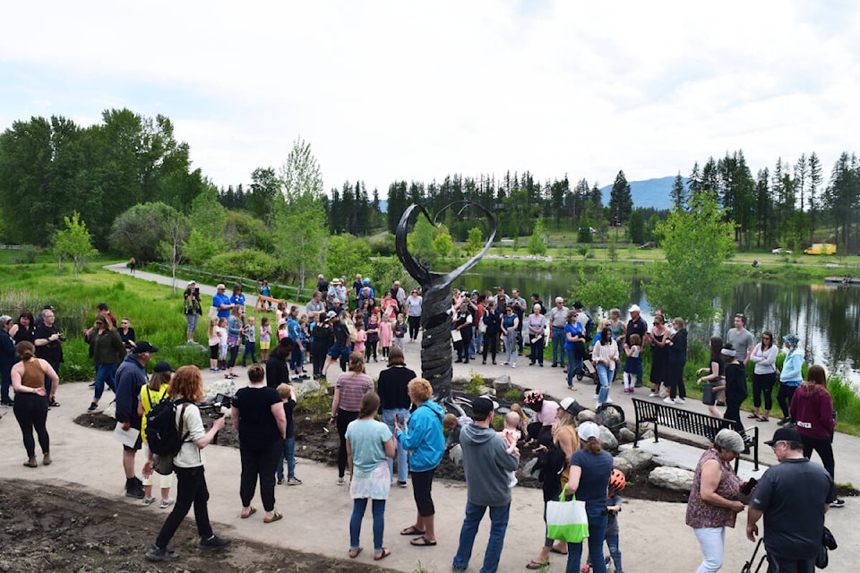 A crowd is pictured gathered around the brand new Peace Pole in Idlewild Park in Cranbrook. A ceremony was held on Friday, June 17 to commemorate the pole’s installation. The Peace Pole was a project between the MBSS Leadership Team and artist Paul Reimer. (Corey Bullock/Cranbrook Townsman)