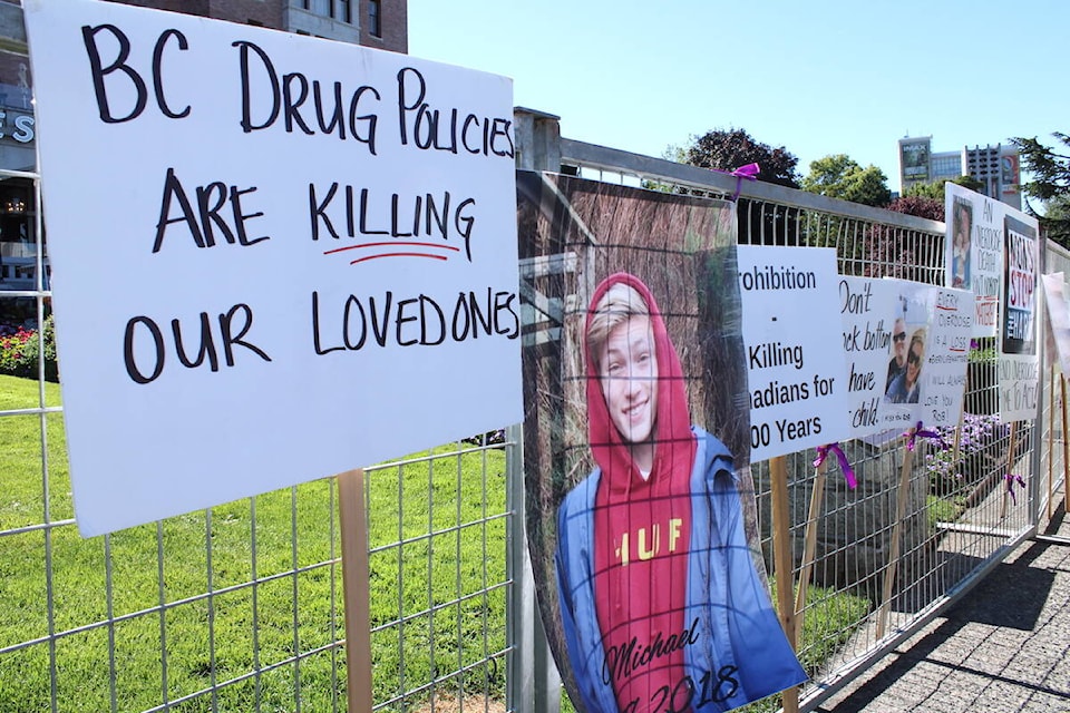 Signs pinned up by Moms Stop the Harm members outside Victoria’s Fairmont Empress hotel, where Canada’s premiers were meeting on July 12. (Jake Romphf/News Staff)