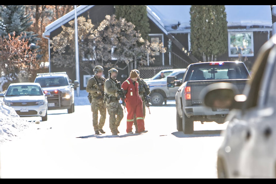 RCMP ERT officers apprehend a suspect in Marysville.