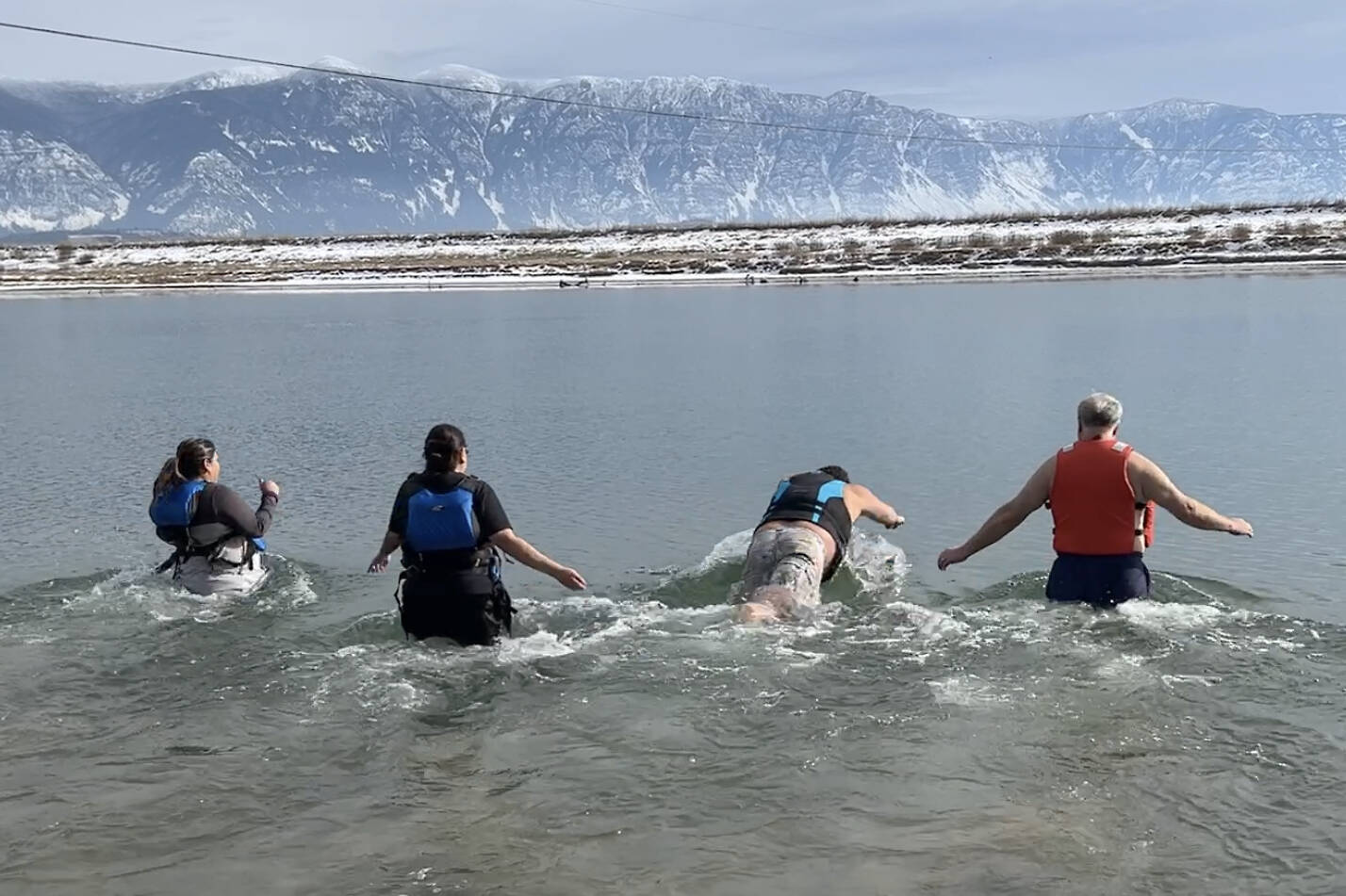 Members of Lower Kootenay Band take the plunge with Interior Health Director of Clinical Operations Walter Felitsyn. (Photo by Kelsey Yates)