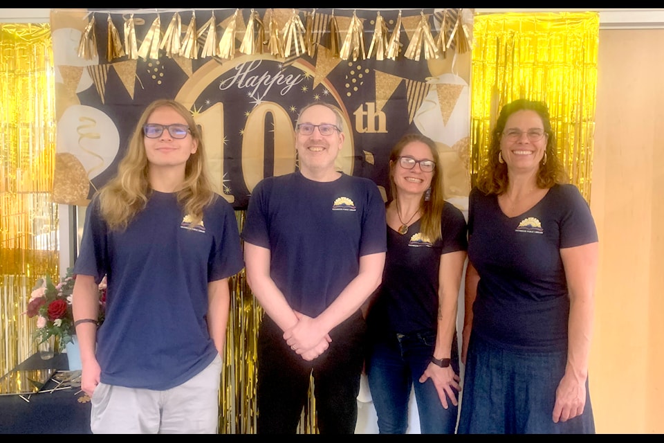 Staff, patrons and everyone in between celebrated 100 years of stories with the Cranbrook Public Library on July 4, 2025. 
Pictured: Jackson Tomlin, Mike Selby, Tanis Banks and Ursula Brigl. (Barry Coulter/Cranbrook Townsman)