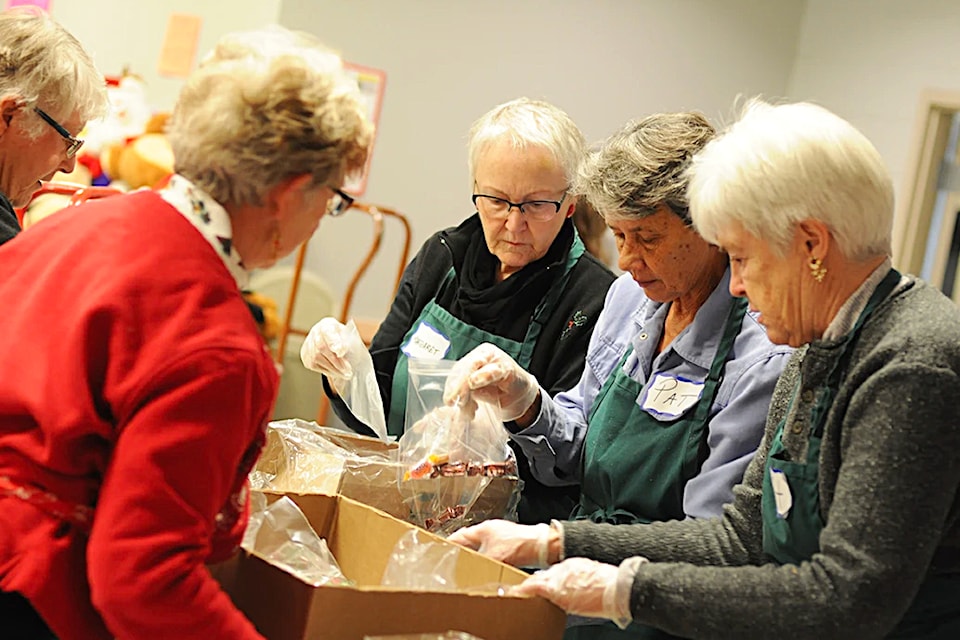 Volunteers sorting Christmas hampers for the annual Creston Valley Ministerial Association program. 