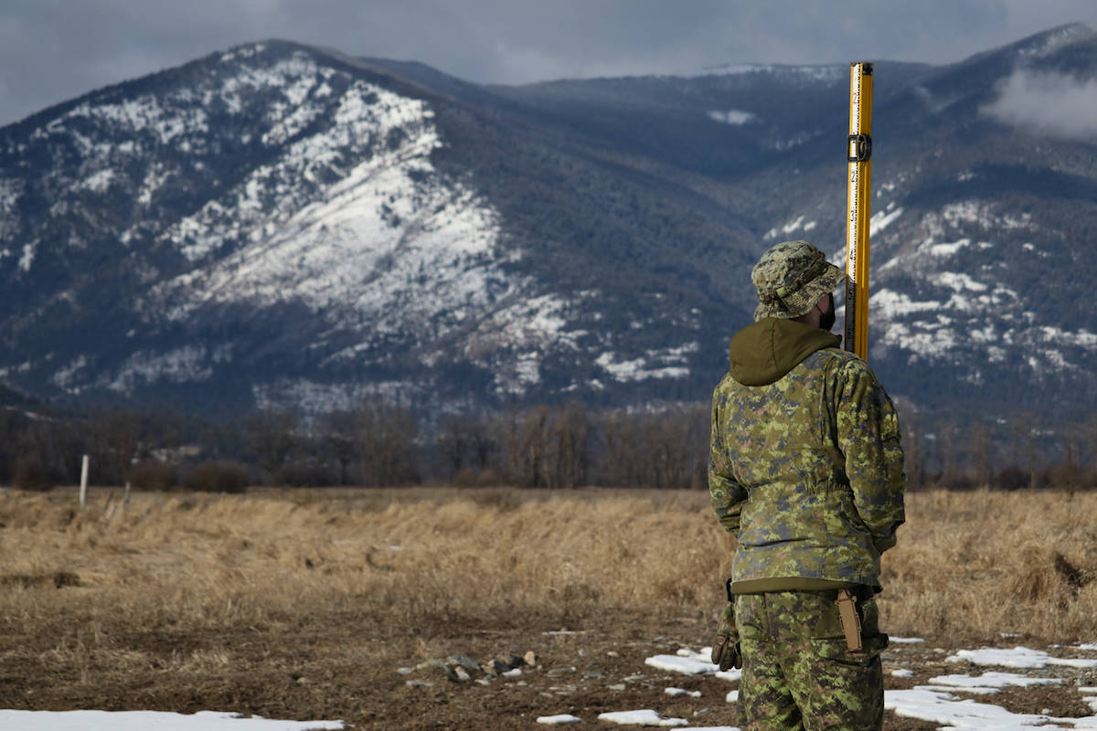 A soldier participates in a bridge surveying exercise. Photo: Aaron Hemens