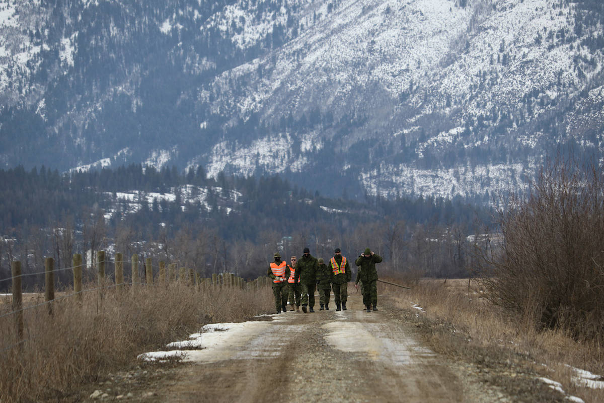 Soldiers walk along a path in the Lower Kootenay Band's wetlands. Photo: Aaron Hemens