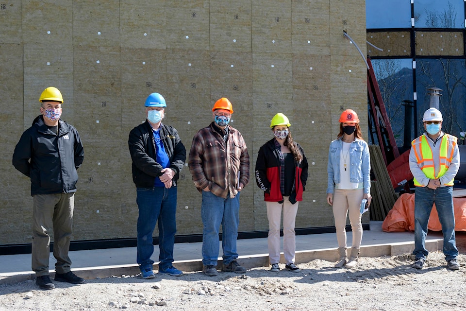 A new multi-million-dollar wellness centre for the Lower Kootenay Band is nearing completion. Chief Jason Louie (far left) stands with LKB staff members and the construction team. (Photo by Kelsey Yates)