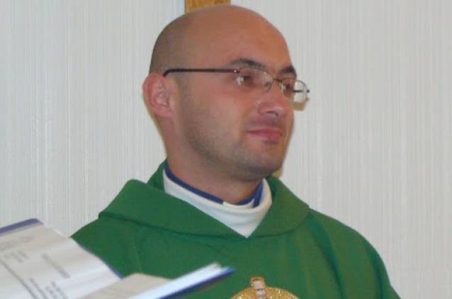 26163951_web1_catholic-priest-rev