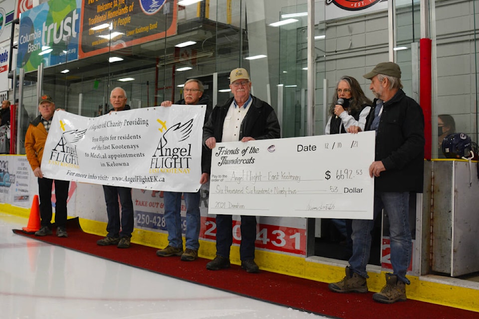 On Dec. 10, Friends of the Thunder Cats presented a donation of $6,693 to Angel Flight to continue their mission of flying local patients in need to Kelowna and other centres for treatment. (Photo by Kelsey Yates)