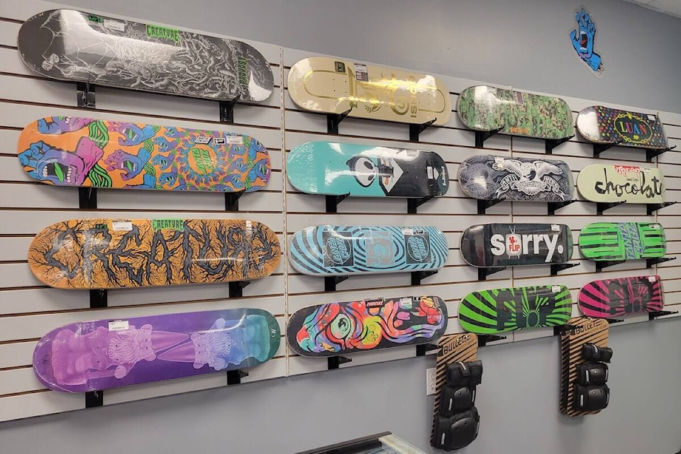 Photo of skateboard rack wall inside shop taken by Senya Calladine.