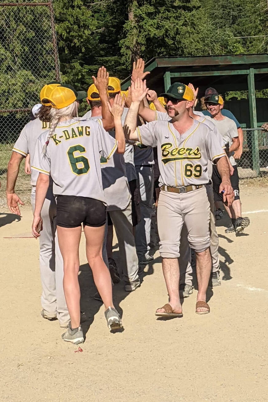 Team players high five after the game. (Submitted)