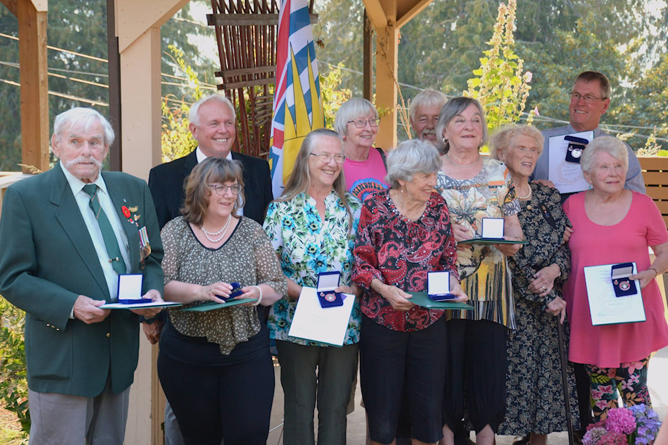 MP Rob Morrison poses with the recipients of the Queen’s Jubilee Award. (Photo by Kelsey Yates)