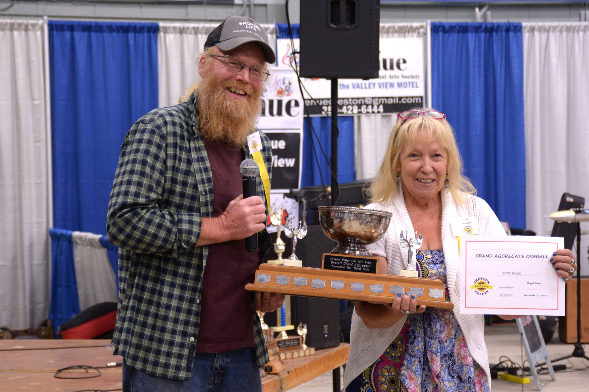 Kevin Viers, Fall Fair board president, poses with Grand Aggregate Overall winner Betty Falck.(Photo by Kelsey Yates)