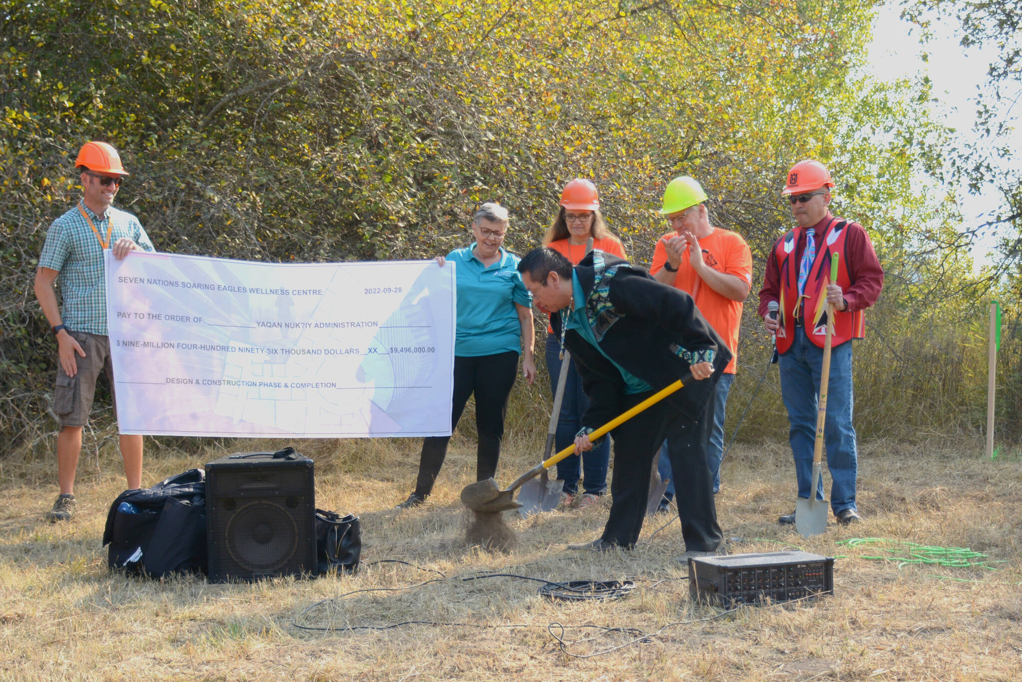 Mary Basils grandson ceremoniously breaks ground at the construction site. (Photo by Kelsey Yates)