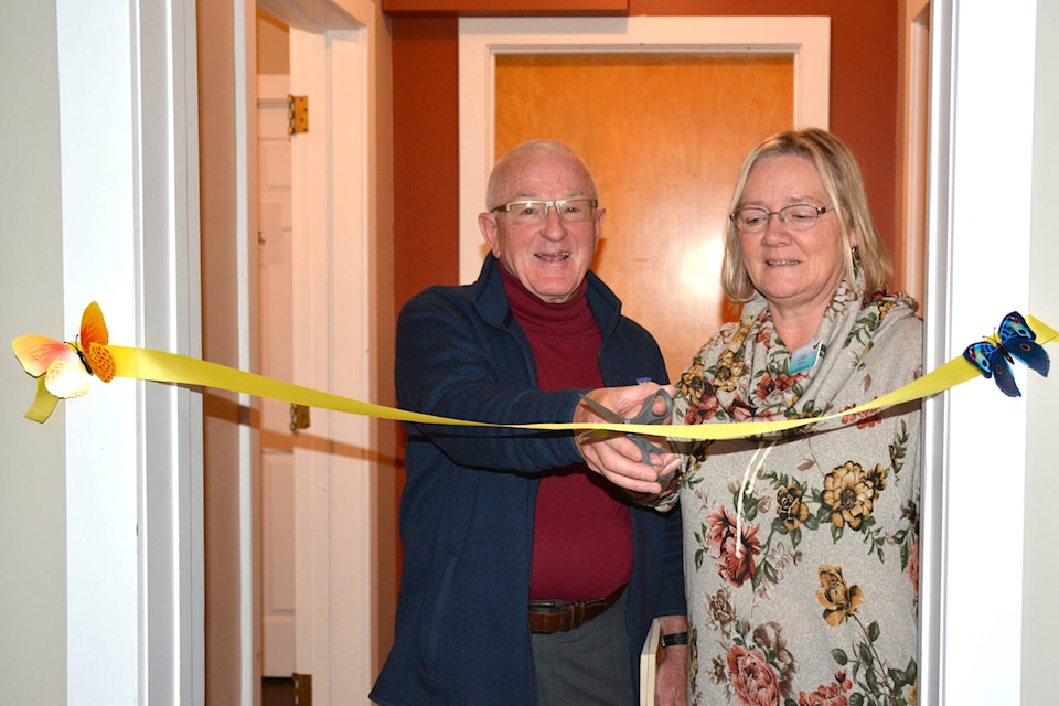 Leslie Kelner, President of Creston Valley Hospice Society, and Reverend Harry Haberstock cut the ribbon at the new office on Oct. 27. (Photo by Kelsey Yates)