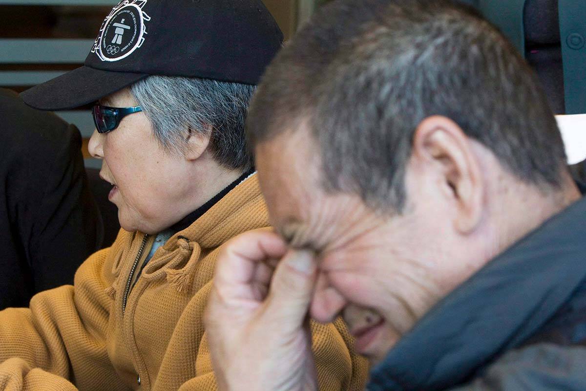 Murder victim Amanda Zhaos mother Baoying Yang (left) and father Zisheng Zhao pause for a moment during a news conference in Vancouver, Monday, Oct. 20, 2008. Fifteen years later, the family is calling for action after learning their daughters killer is seeking refugee status in New Zealand. THE CANADIAN PRESS/Jonathan Hayward