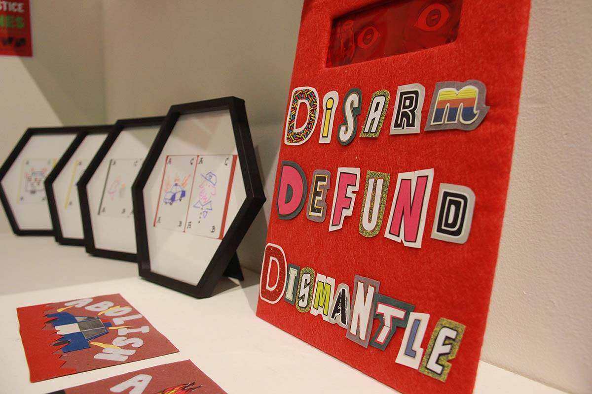 A defund the police display at Gallery Gachet in Vancouver, where a gathering for the International Day Against Police Brutality was held on March 15, 2022. (Jane Skrypnek/Black Press Media)