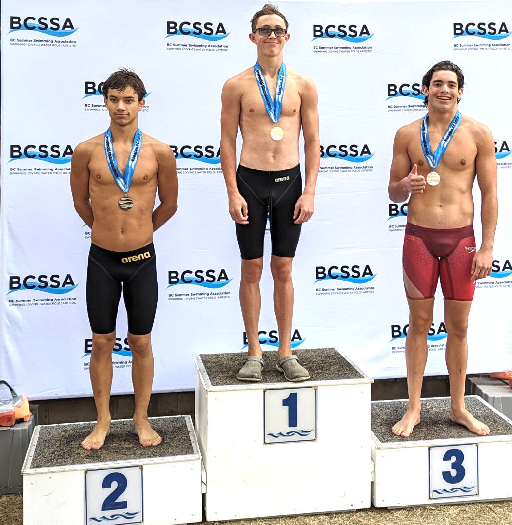 Callum Ziefflie, centre, took first place in all four events he competed in, as well as breaking a 22-year-old provincial record in the 100-metre freestyle.