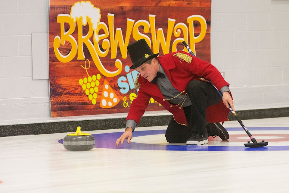 Lew Dies curls in his ringmaster costume at the circus-themed 2018 Curl for Cancer event at the Salmon Arm Curling Centre on Sunday, Nov. 4. (Jim Elliot/Salmon Arm Observer)