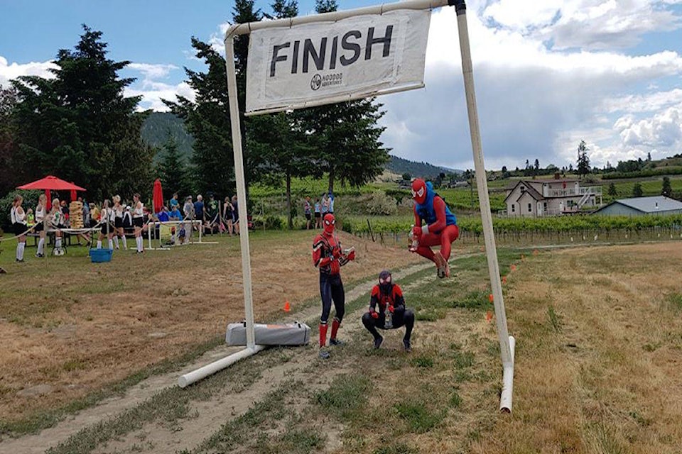 After a long day of fighting crime (drinking brews), Spiderman made it to the finish of the 2019 Penticton Beer Run. (Photo by Jason Lam)