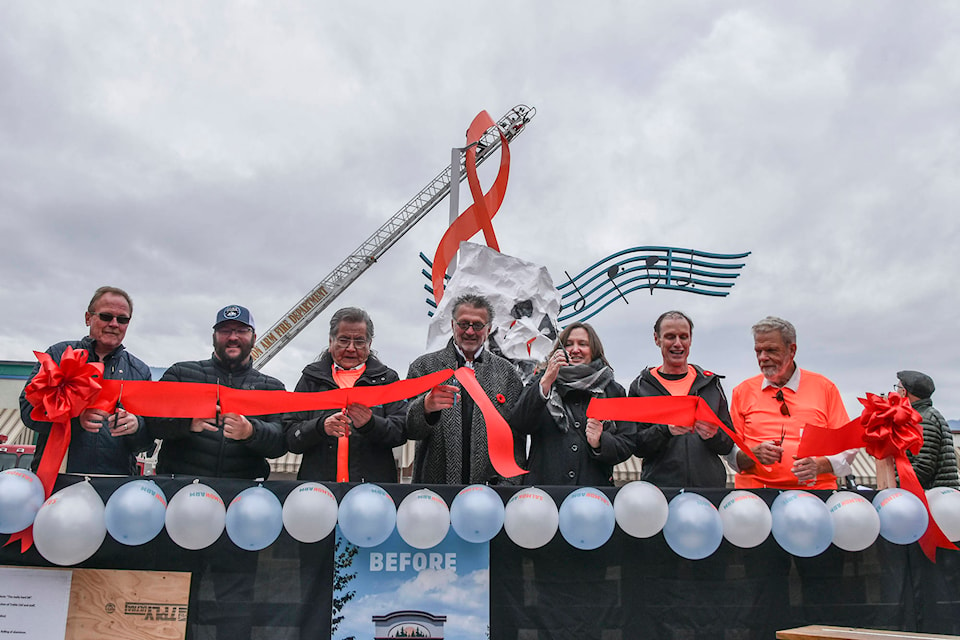 Builders, sponsors and designers cut the ribbon while the treble clef is unveiled on Alexander Street in Salmon Arm on Saturday, Nov. 2, 2019. (Cameron Thomson/Salmon Arm Observer)