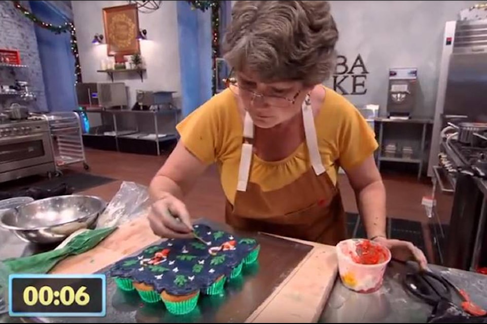 Janet Letendre puts the finishing touches on her cupcake pull-a-part. (Holiday Baking Championship)