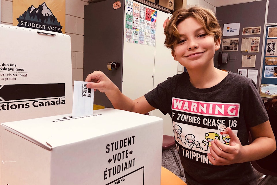 Cole Collingwood casts his mock ballot at Vernon’s Mission Hill Elementary School ahead of the provincial election Oct. 24, 2020. (Brendan Shykora - Morning Star)
