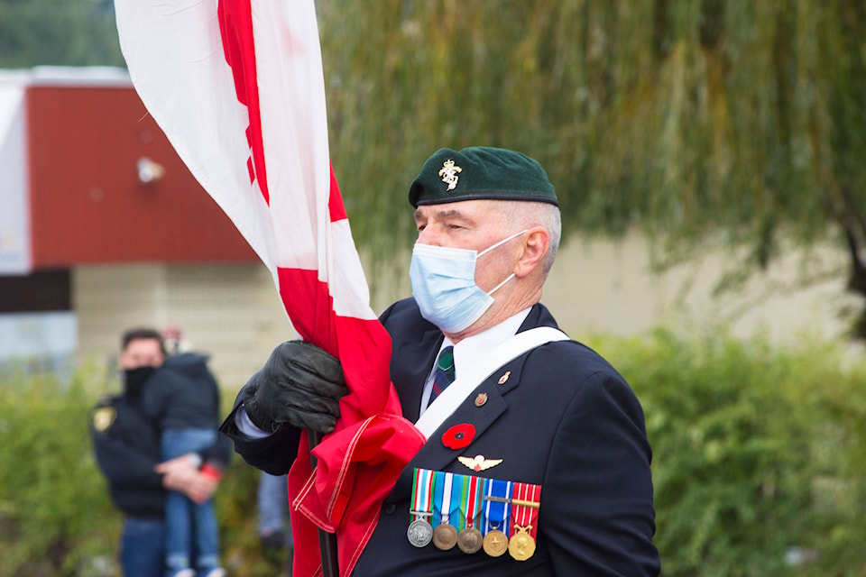 Rob Sutherland leads the Colour Party at the Sicamous Remembrance Day ceremony on Wednesday, Nov. 11. (Jim Elliot-Eagle Valley News)