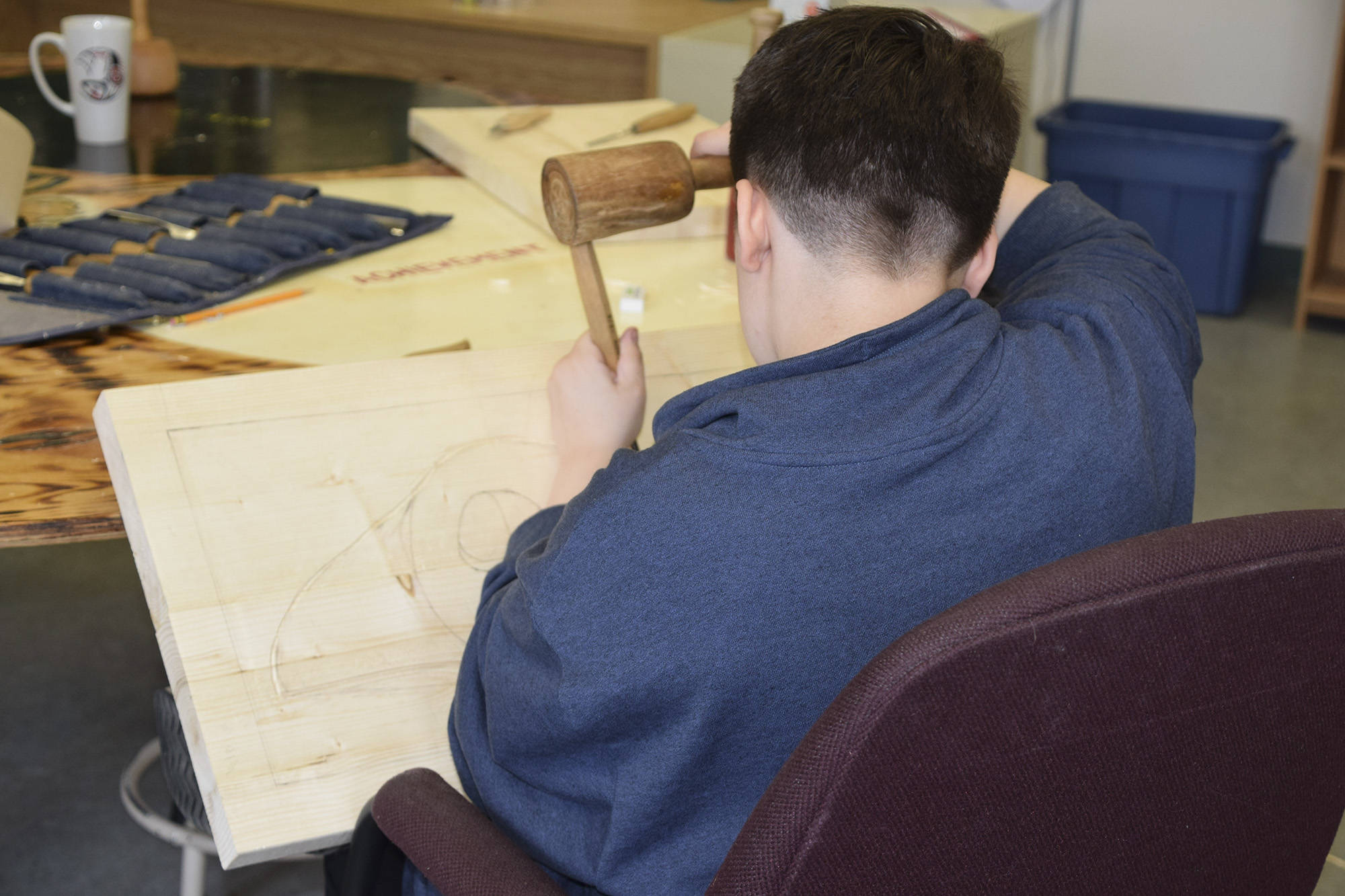 23329116_web1_201125-SAA-student-carving-raven